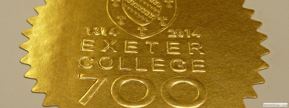 Exeter gold starburst embossed label